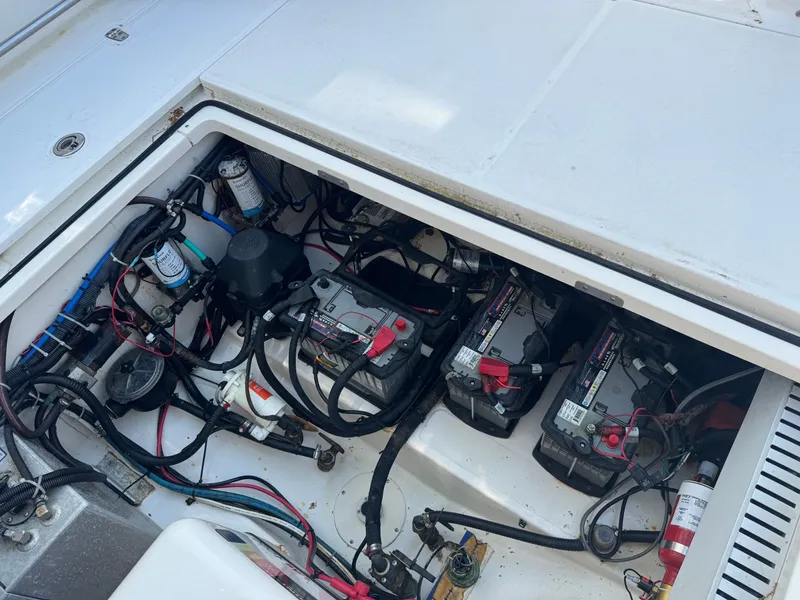 Slide: The Image of Engine compartment of a 2006 Boston Whaler 305 Conquest boat with batteries. - 17