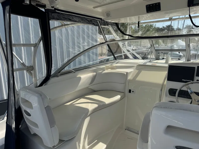 Slide: The Image of Interior of a 2006 Boston Whaler 305 Conquest boat with helm station. - 19