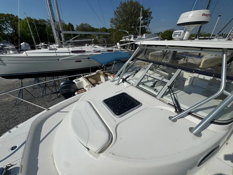 Slide: The Image of 2006 Boston Whaler 305 Conquest boat in harbor, sunny day. - 31