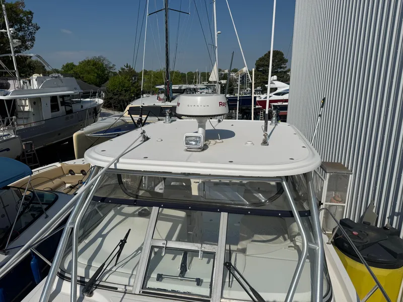 Slide: The Image of 2006 Boston Whaler 305 Conquest docked at marina. - 32