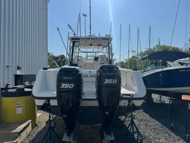 Slide: The Image of 2006 Boston Whaler 305 Conquest with twin Verado 350 engines. - 8