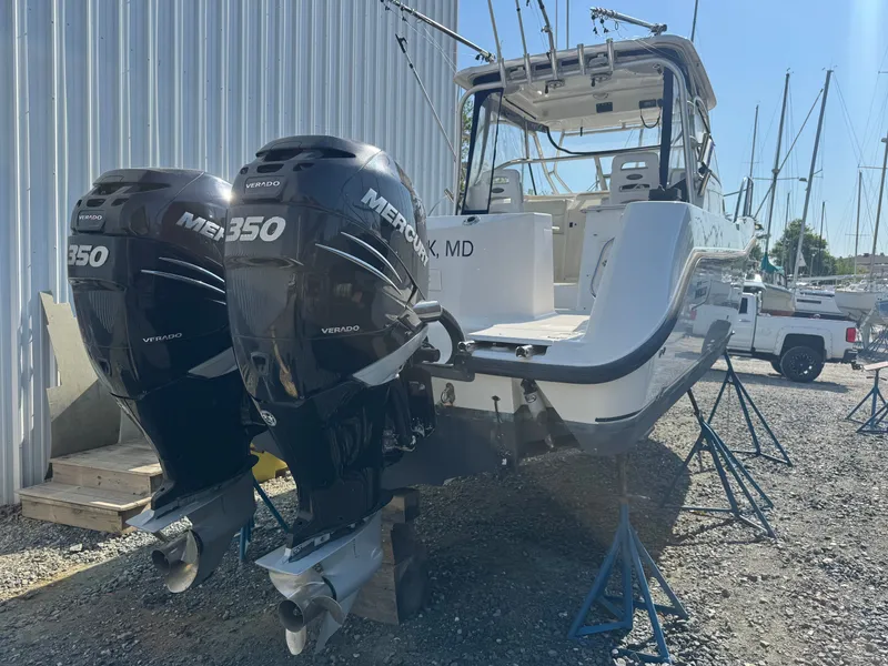 Slide: The Image of 2006 Boston Whaler 305 Conquest with twin Mercury 350 engines. - 9