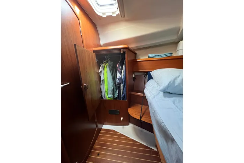 Slide: The Image of Interior cabin of 2004 Jeanneau Sun Odyssey 40 with closet and bed. - 10