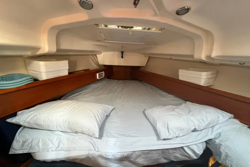 Slide: The Image of Cozy cabin interior of 2004 Jeanneau Sun Odyssey 40 sailboat with comfortable bedding. - 9
