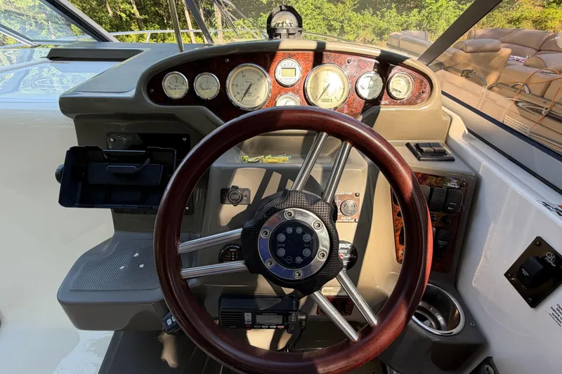 Slide: The Image of Steering wheel and dashboard of a 2008 Regal 2565 Window Express boat. - 11