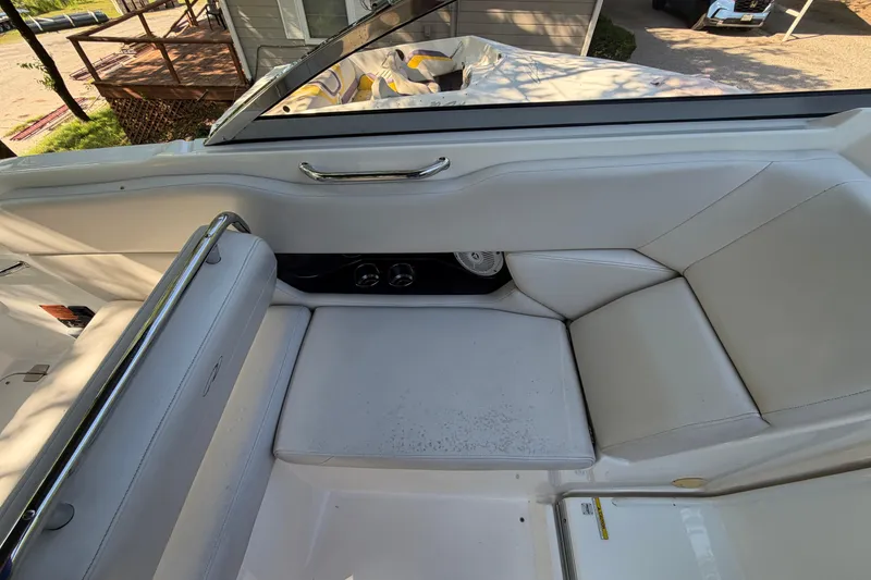 Slide: The Image of 2008 Regal 2565 Window Express boat interior with white seating and chrome accents. - 12