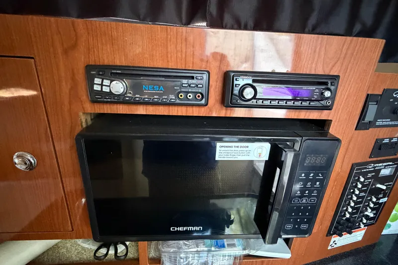 Slide: The Image of Interior of a 2008 Regal 2565 Window Express with microwave and audio systems. - 15