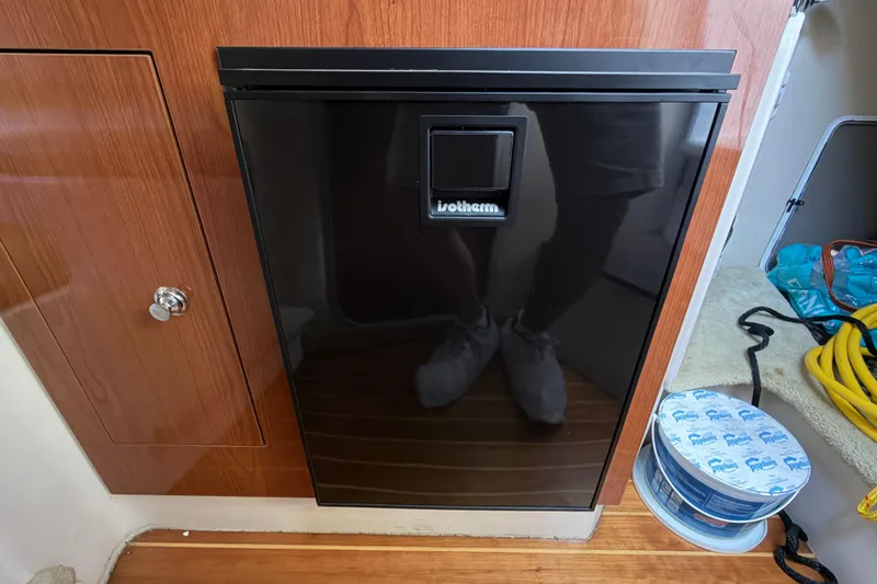 Slide: The Image of Compact fridge in 2008 Regal 2565 Window Express boat interior. - 23