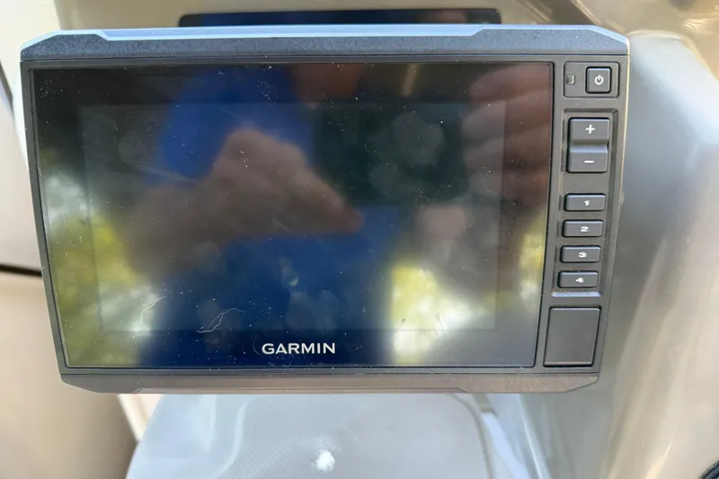 Slide: The Image of Garmin navigation system on a 2008 Regal 2565 Window Express boat dashboard. - 24