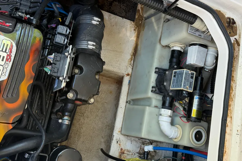 Slide: The Image of Engine compartment of a 2008 Regal 2565 Window Express boat, showing detailed components. - 27