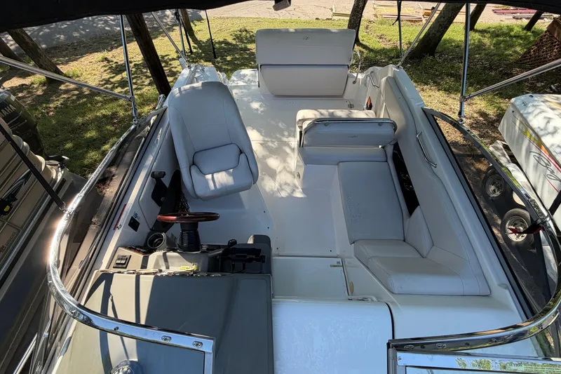 Slide: The Image of 2008 Regal 2565 Window Express boat interior with seating and steering wheel. - 9