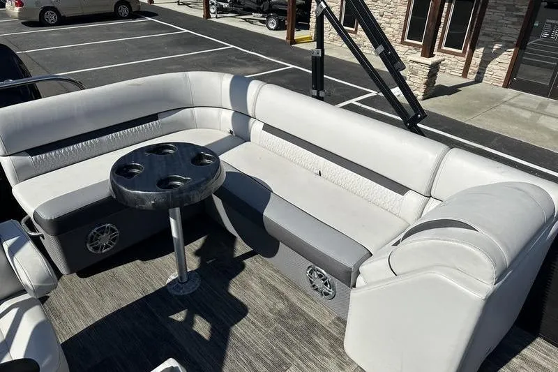 Slide: The Image of 2022 Godfrey Sweetwater 2186 C4 pontoon boat interior with seating and cupholder table. - 12