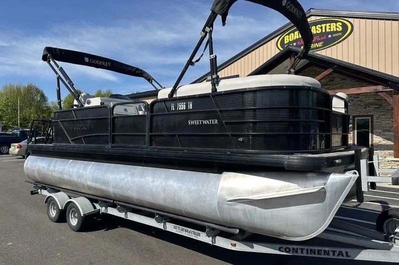 Slide: The Image of 2022 Godfrey Sweetwater 2186 C4 pontoon boat on trailer outside dealership. - 15