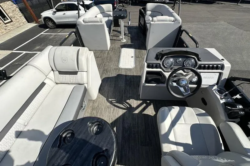 Slide: The Image of Interior view of 2022 Godfrey Sweetwater 2186 C4 pontoon boat with seating and steering console. - 18