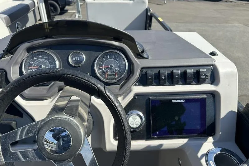 Slide: The Image of Dashboard of 2022 Godfrey Sweetwater 2186 C4 boat with steering wheel and controls. - 19