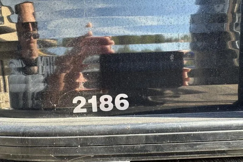Slide: The Image of Close-up of 2022 Godfrey Sweetwater 2186 C4 boat model number on reflective surface. - 20