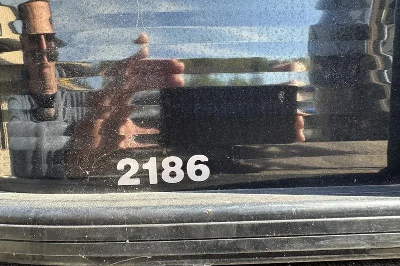 Slide: The Image of Reflection on Godfrey Sweetwater 2186 C4 boat, model year 2022, with visible number "2186". - 21