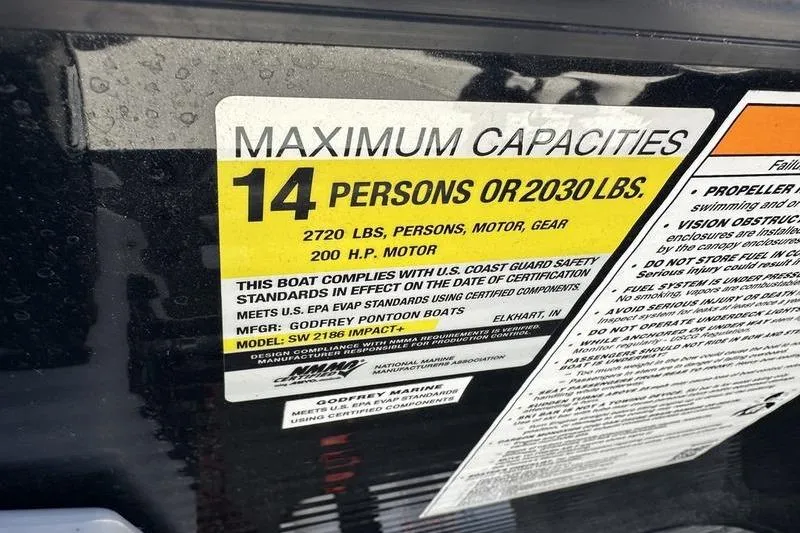 Slide: The Image of Maximum capacity label for 2022 Godfrey Sweetwater 2186 C4 boat, 14 persons or 2030 lbs. - 26