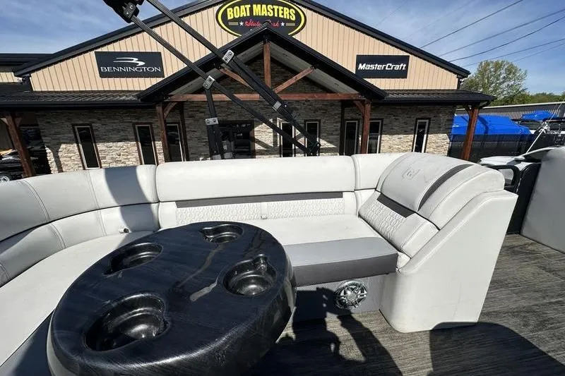 Slide: The Image of 2022 Godfrey Sweetwater 2186 C4 pontoon boat interior with seating and cup holders. - 3