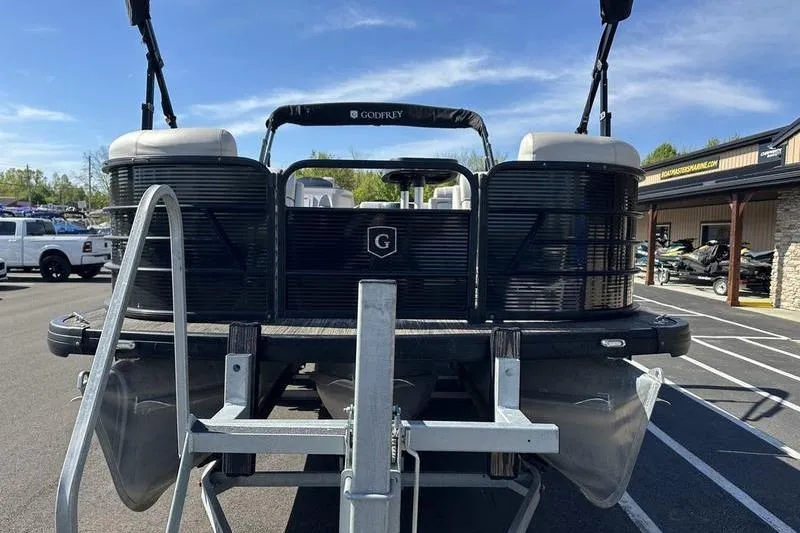 Slide: The Image of 2022 Godfrey Sweetwater 2186 C4 pontoon boat on trailer, parked outdoors. - 9