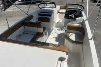 Slide: The Image of 2022 Bayliner VR6 Bowrider OB interior with spacious seating and modern design. - 7