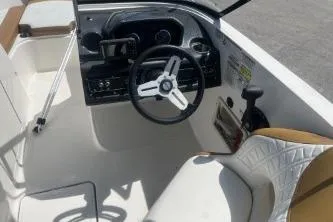 Slide: The Image of 2022 Bayliner VR6 Bowrider OB cockpit with steering wheel and seating. - 8