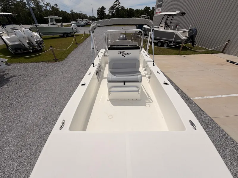 Slide: The Image of 2022 KenCraft Bay Rider 2060 boat on a parking lot. - 11