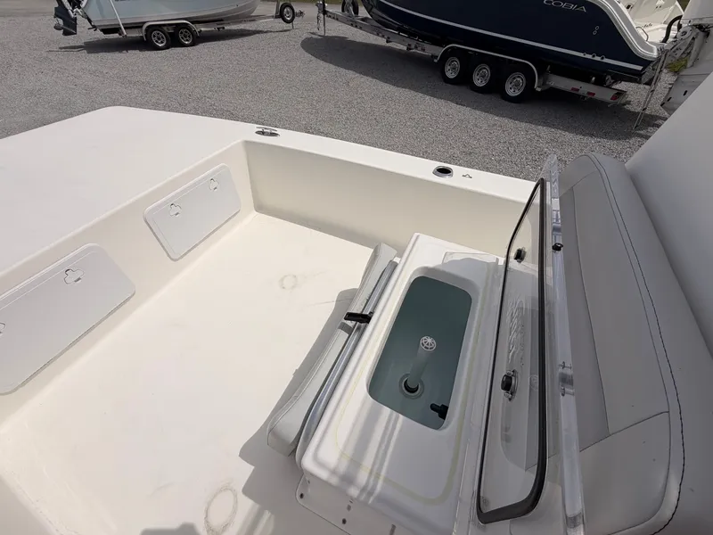 Slide: The Image of 2022 KenCraft Bay Rider 2060 boat interior with storage compartments. - 12