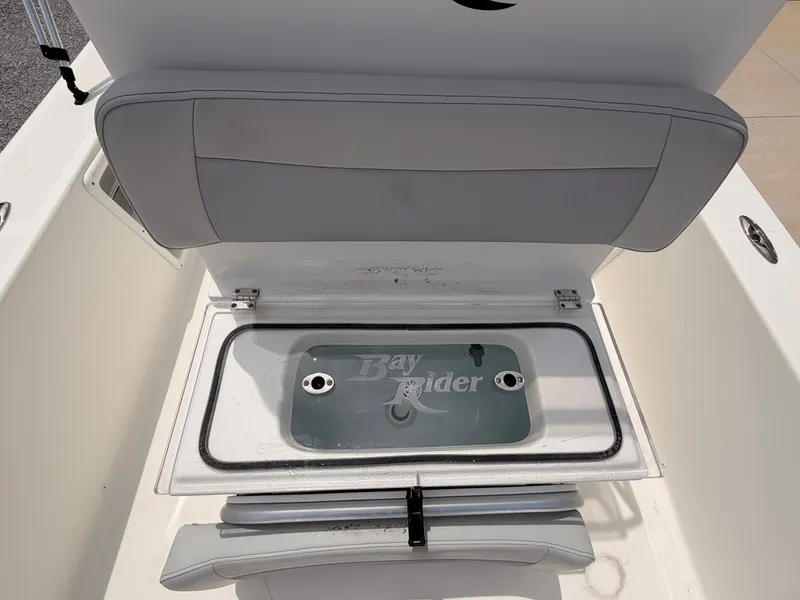 Slide: The Image of 2022 KenCraft Bay Rider 2060 boat with open storage compartment. - 13