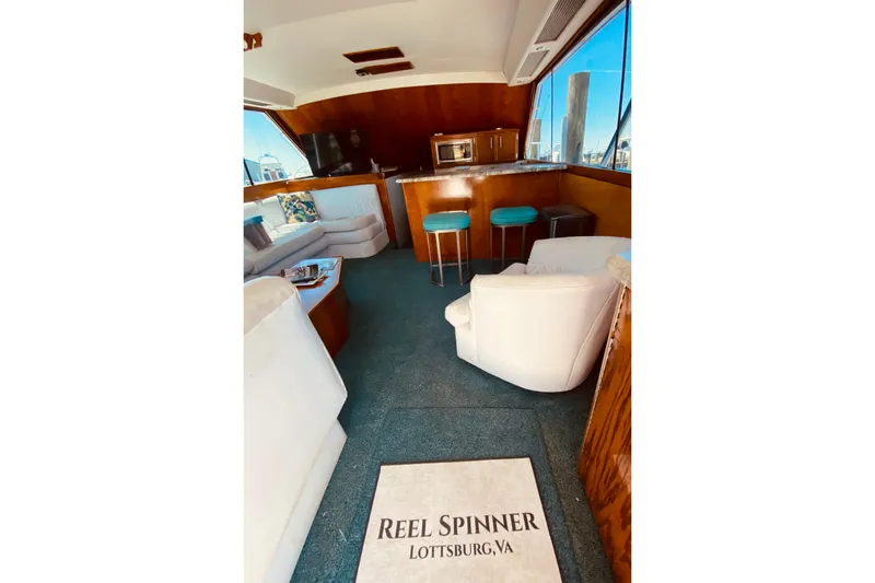 Slide: The Image of Interior of 1986 Ocean Yachts 48 Super Sport with seating and galley.  - 12