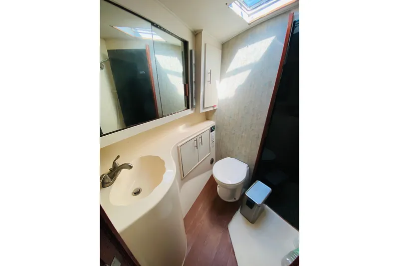 Slide: The Image of Starboard forward bath connected to the master bedroom.   - 14