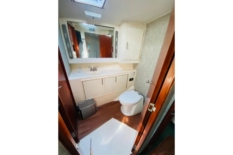 Slide: The Image of Port side bathroom with hall and bedroom access.  - 18