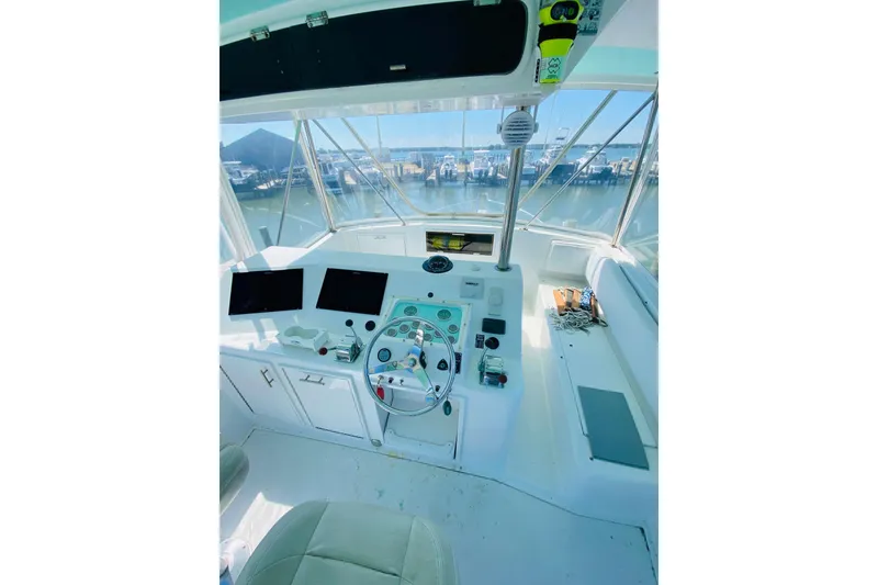 Slide: The Image of Bridge of 1986 Ocean Yachts 48 Super Sport with modern navigation equipment. - 23
