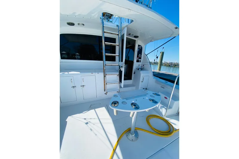 Slide: The Image of 1986 Ocean Yachts 48 Super Sport yacht deck with ladder and fishing station. - 4