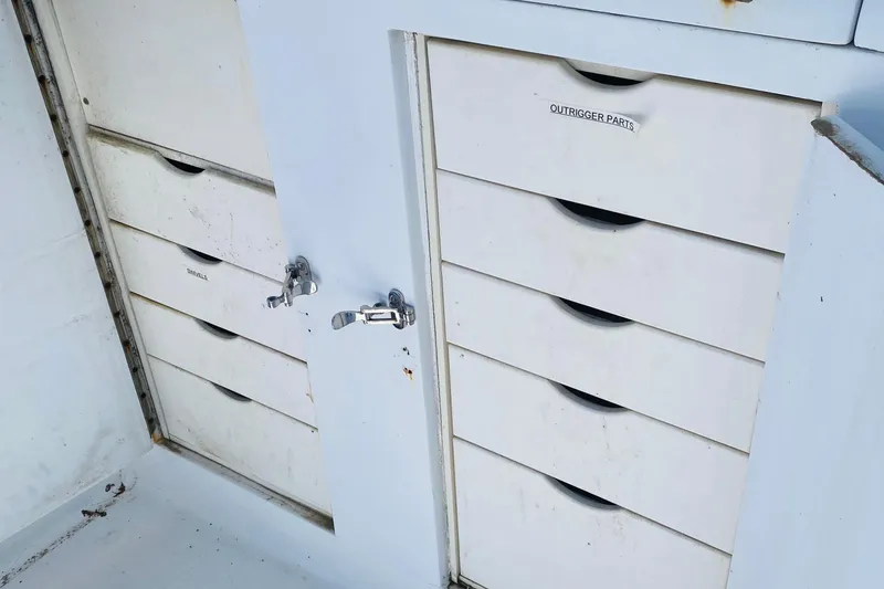 Slide: The Image of Tackle drawers on a 1986 Ocean Yachts 48 Super Sport boat deck. Sink above. - 6