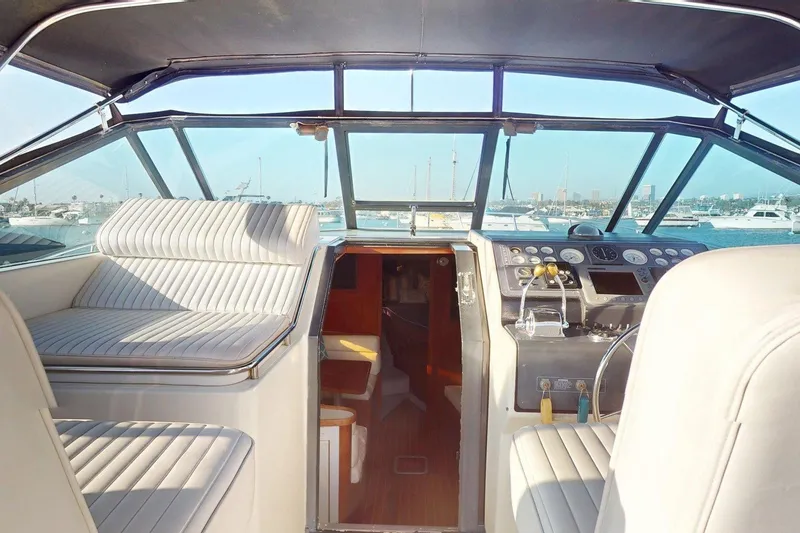 Slide: The Image of Interior view of 1989 Tiara 3300 Open yacht with helm and seating area. - 18