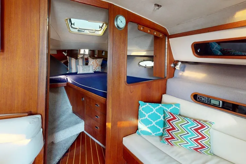 Slide: The Image of Interior of a 1989 Tiara 3300 Open yacht with cozy seating and vibrant cushions. - 28