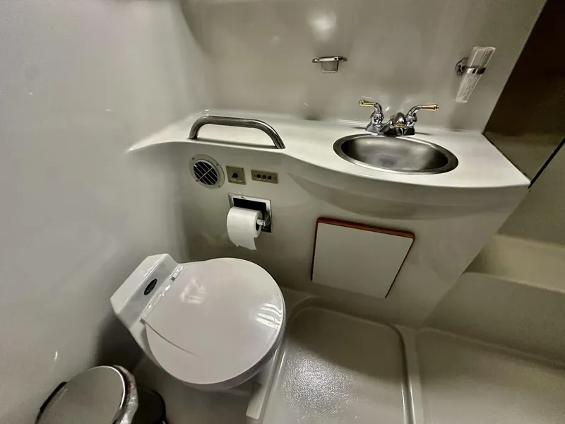 Slide: The Image of 1990 Sea Ray 380 Aft Cabin yacht bathroom interior. - 11