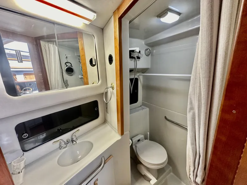 Slide: The Image of Interior view of 1990 Sea Ray 380 Aft Cabin bathroom. - 6