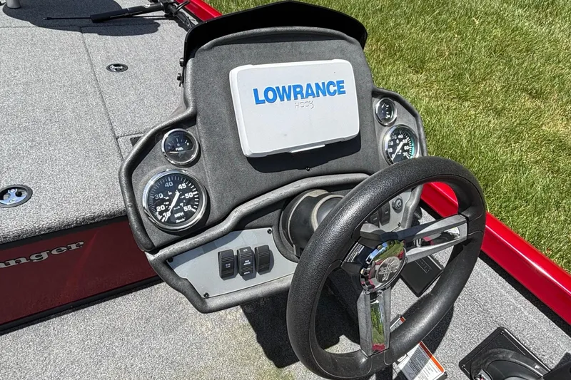 Slide: The Image of 2024 Ranger RT188 boat dashboard with Lowrance display and steering wheel. - 12