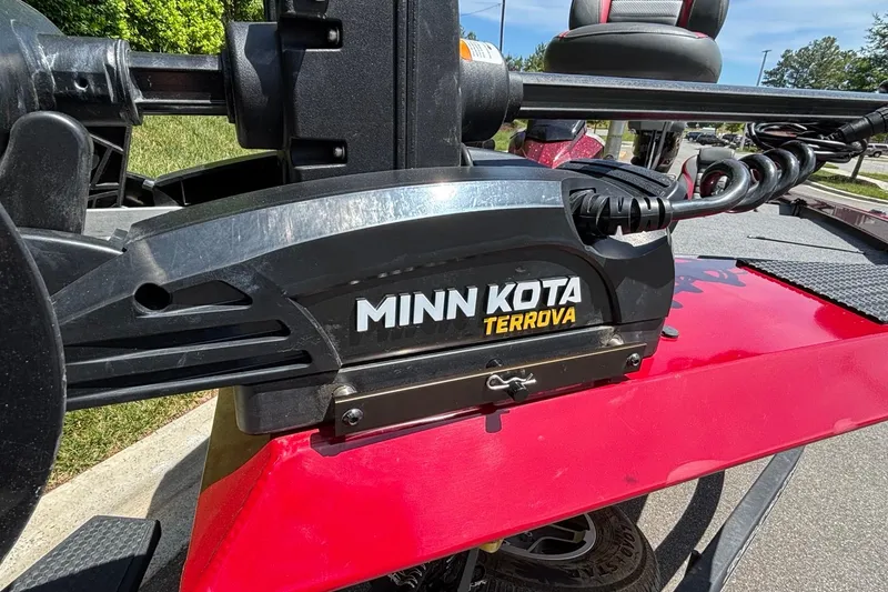 Slide: The Image of Minn Kota Terrova motor on 2024 Ranger RT188 boat, red deck, sunny day. - 7