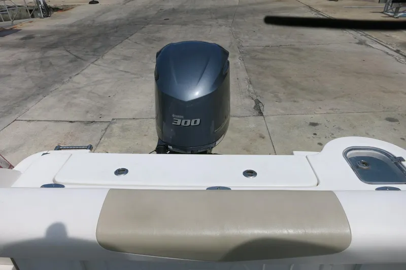 Slide: The Image of 2018 Robalo R247 Dual Console with Yamaha 300 outboard engine, docked on concrete. - 10
