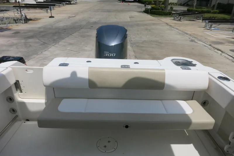Slide: The Image of 2018 Robalo R247 Dual Console boat with Yamaha 300 engine, featuring rear seating area. - 11