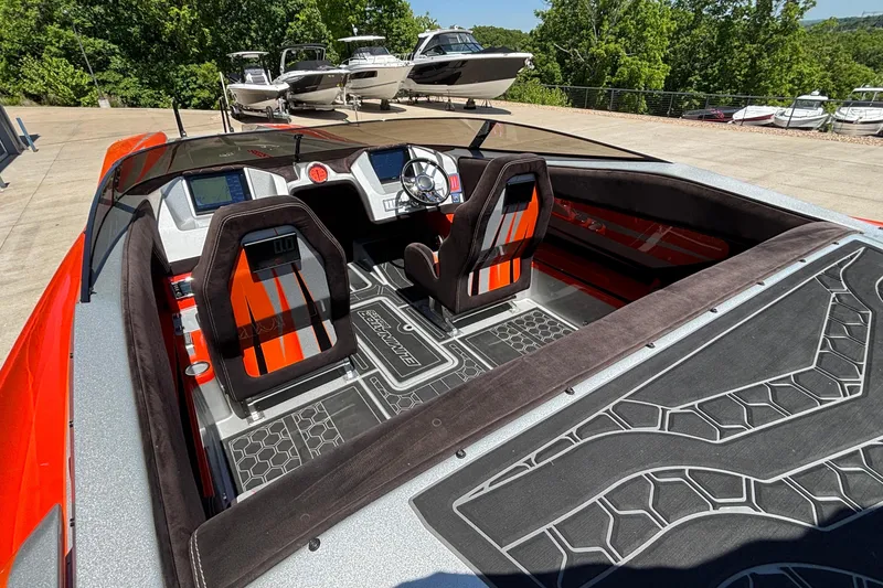 Slide: The Image of 2020 Eliminator 36 Daytona Coupe interior with sleek design and vibrant orange accents. - 10