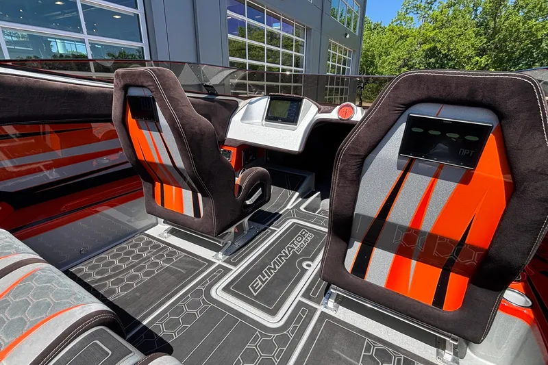 Slide: The Image of Interior of 2020 Eliminator 36 Daytona Coupe with sleek orange and black seating. - 13