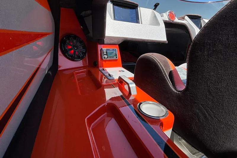 Slide: The Image of Interior of 2020 Eliminator 36 Daytona Coupe with red accents and audio system. - 15