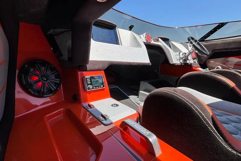 Slide: The Image of 2020 Eliminator 36 Daytona Coupe interior with modern dashboard and vibrant red accents. - 16