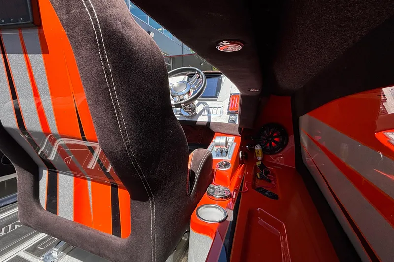 Slide: The Image of Interior of 2020 Eliminator 36 Daytona Coupe with vibrant orange and black design. - 17