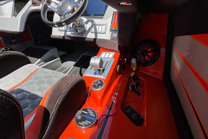 Slide: The Image of Interior of a 2020 Eliminator 36 Daytona Coupe with modern controls and vibrant design. - 18