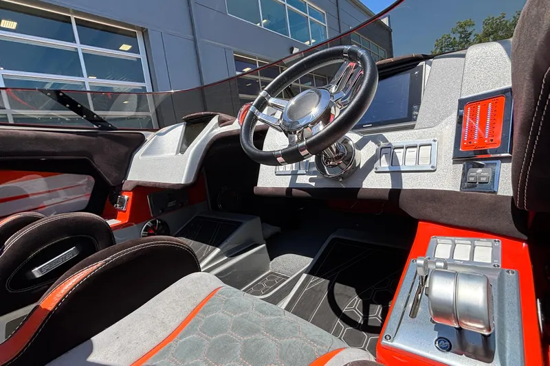 Slide: The Image of Interior of a 2020 Eliminator 36 Daytona Coupe, featuring a sleek steering wheel and modern controls. - 19